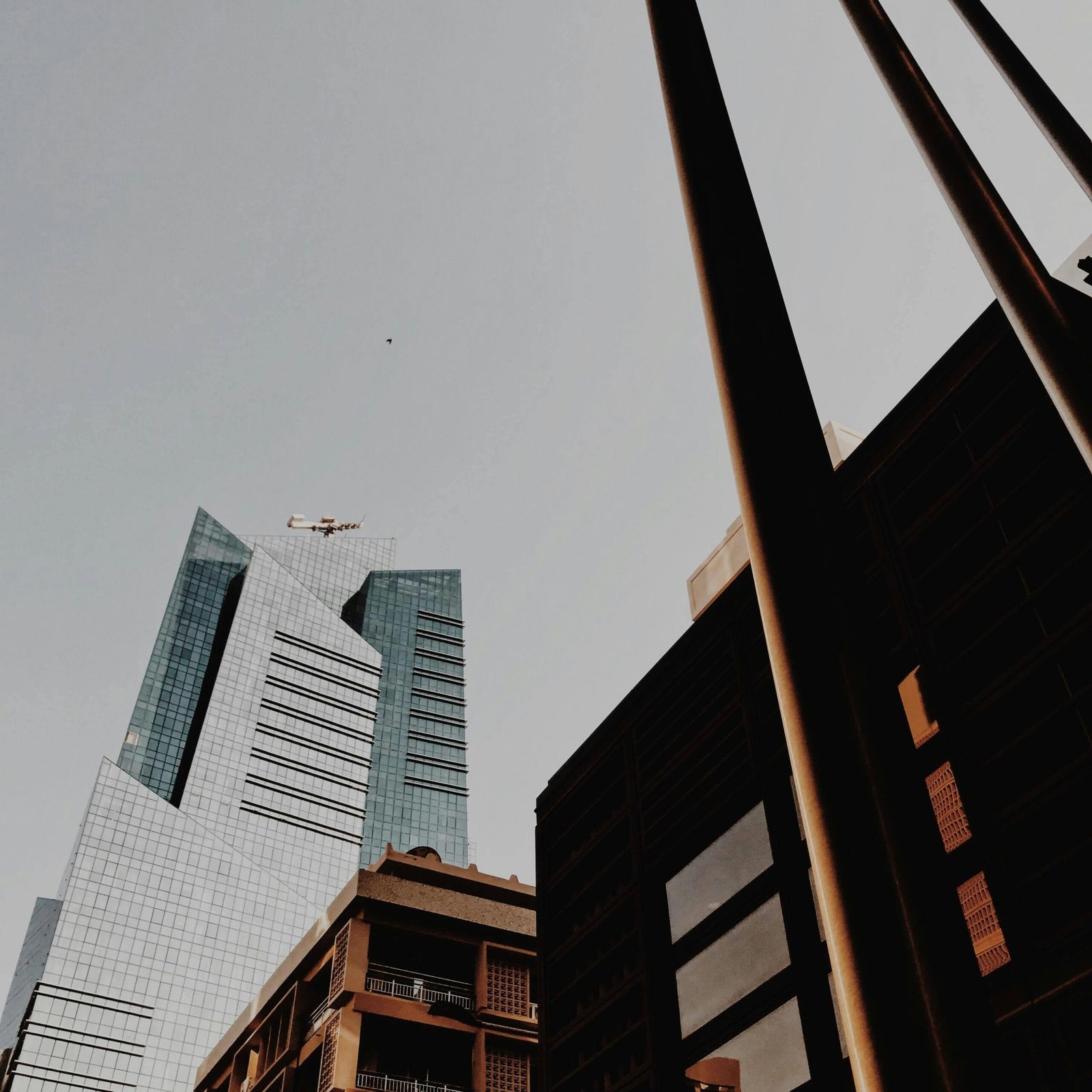 Distinctive skyscrapers under a clear sky in Abu Dhabi, showcasing modern architecture and urban development.