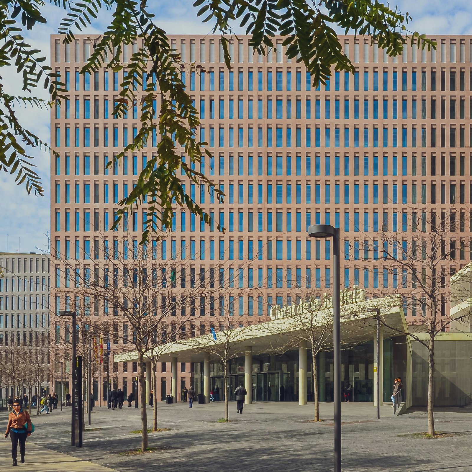 Elegant modern architecture of a government building in a bustling city street.