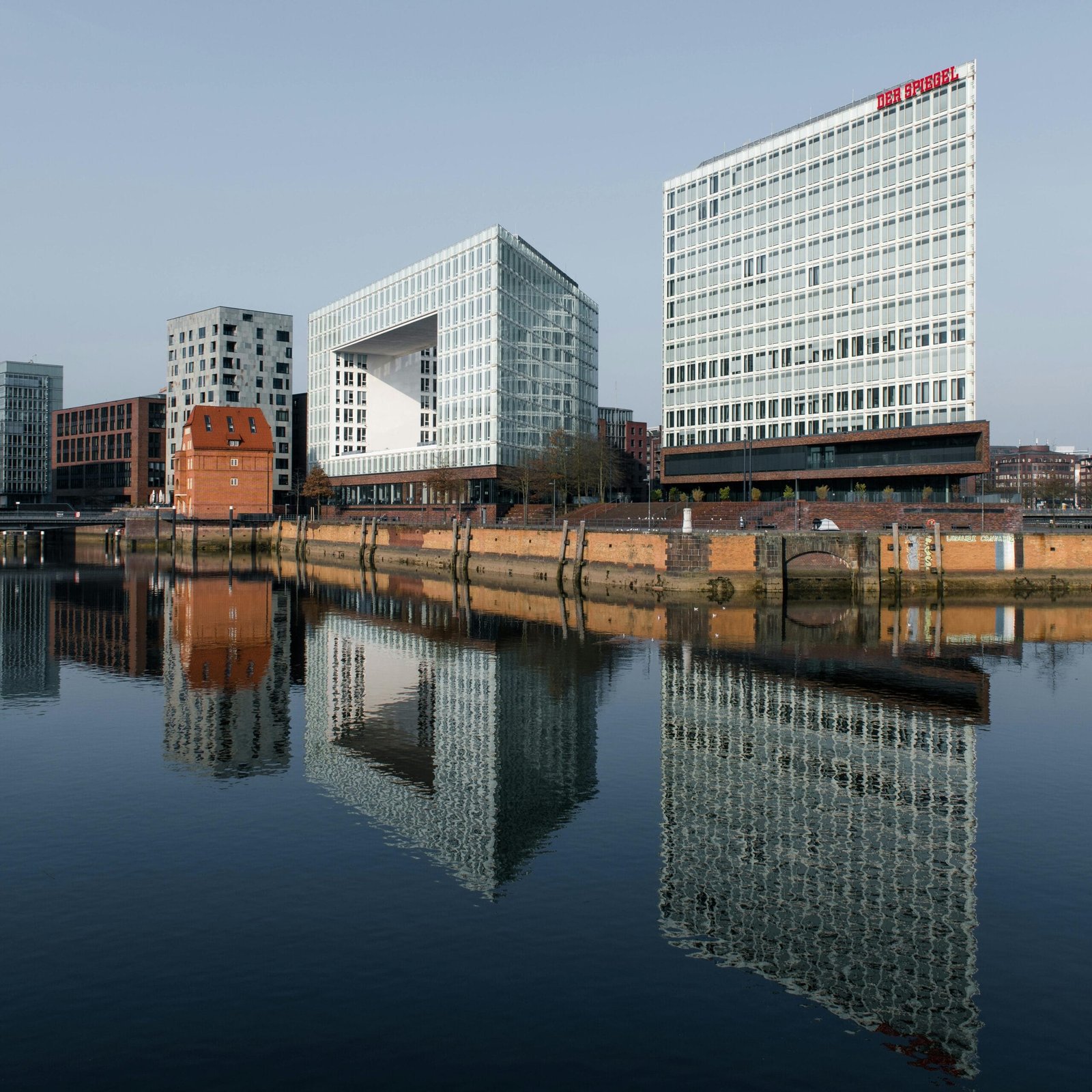 Captivating view of modern buildings reflecting in the water in Hamburg, Germany.