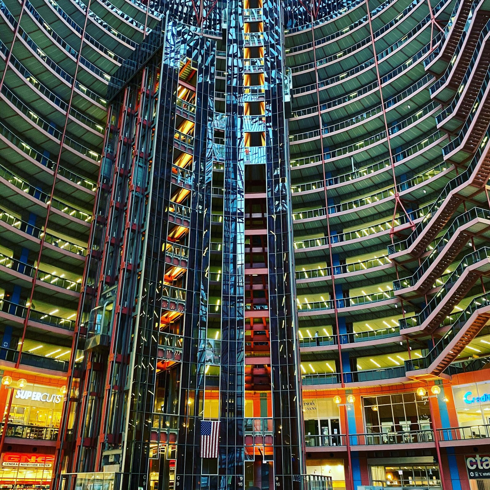 Interior view of a modern atrium showcasing stunning architectural design and office spaces.