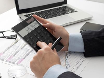 man using his calculator