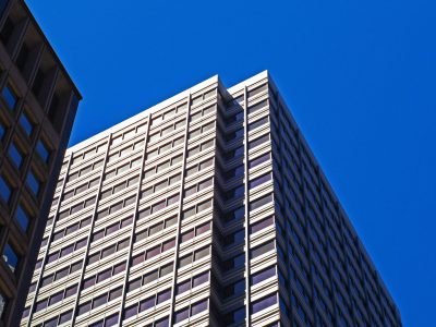 Urban skyscraper in San Francisco with a modern architectural design under a clear blue sky.