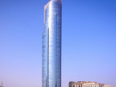 A breathtaking view of a modern skyscraper reflecting the sky in Dubai.