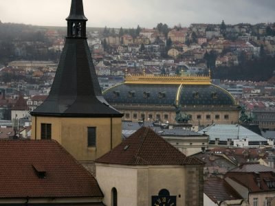 Captivating view of Prague's iconic architecture under a dramatic sky, highlighting historical landmarks.
