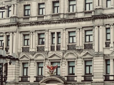 Elegant colonial architectural facade of Bangkok Bank building in an urban setting.