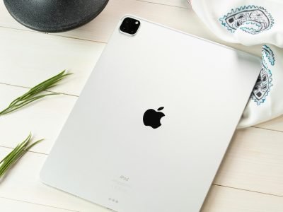 A contemporary tablet displayed on a styled flat lay, showcasing modern technology aesthetics.