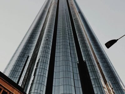 Low angle view of a towering modern skyscraper in Abu Dhabi, UAE, showcasing urban architecture.